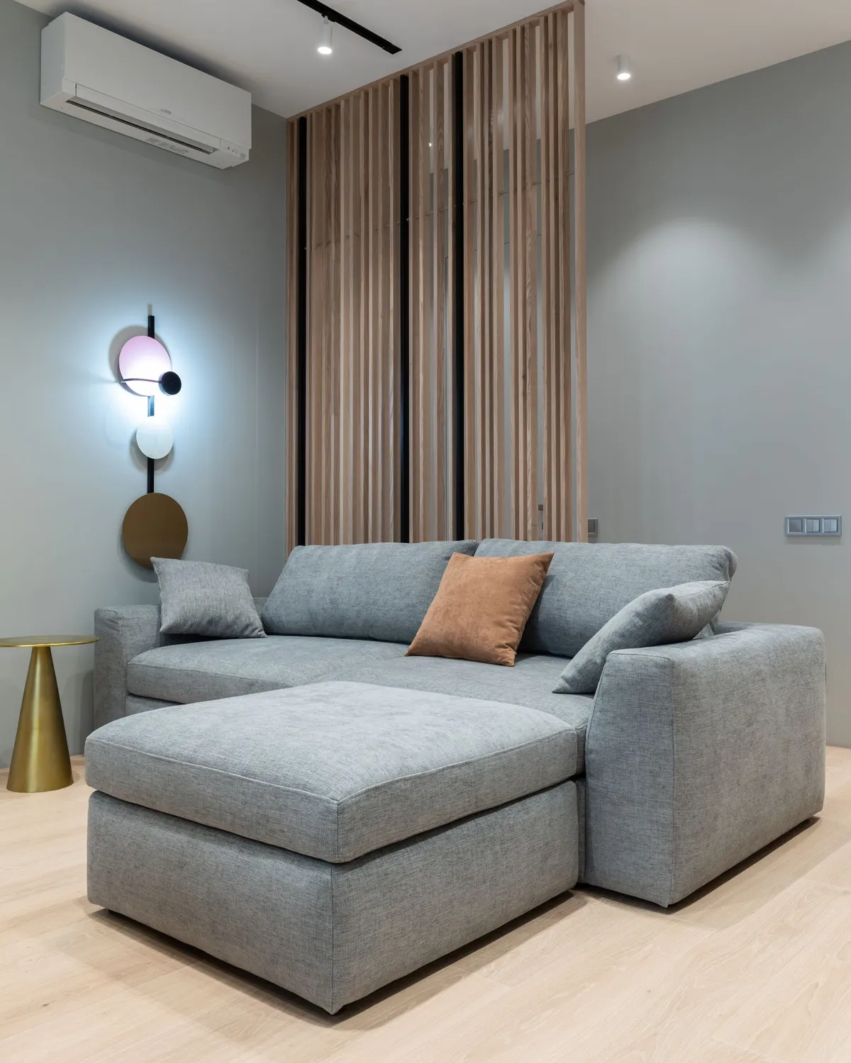 Modern living room with a wall-mounted air conditioning unit